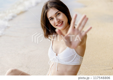 Beautiful girl on sun tanning in a tropical beach. Beautiful girl on sun tanning in a tropical beach. 117548806