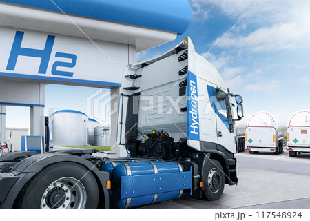 A hydrogen fuel cell semi truck with H2 gas cylinder onboard next to filling station. Eco-friendly commercial vehicle concept A hydrogen fuel cell semi truck with H2 gas cylinder onboard next to filling station. Eco-friendly commercial vehicle concept 117548924
