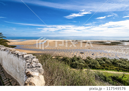 The beach of Cacela Velha in the Algarve region of southern Portugal. The beach of Cacela Velha in the Algarve region of southern Portugal. 117549576