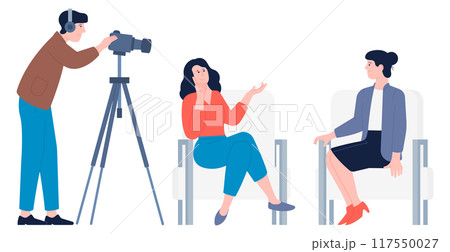 Interview studio. Operator with video camera shooting women talking 117550027