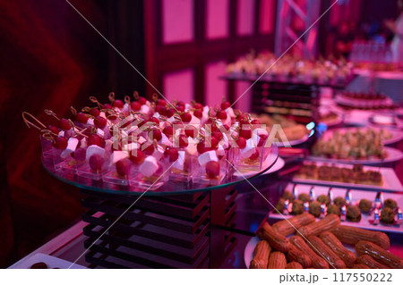Buffet table with appetizers and finger foods, creating an elegant dining experience 117550222
