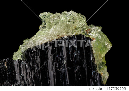 Macro stone Hyalite mineral, tourmaline Sherl, smoky quartz on a black background 117550996