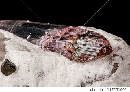 Macro stone tourmaline mineral on a black background  117551002