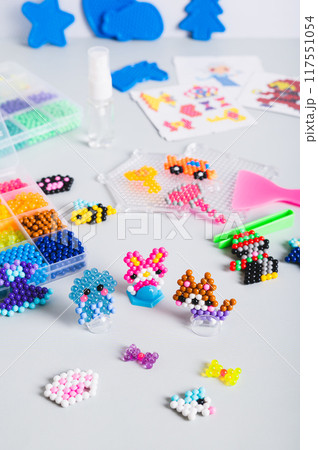 Aqua beads for the development of fine motor skills of children and the creation of decor vertical Aqua beads for the development of fine motor skills of children and the creation of decor vertical 117551054