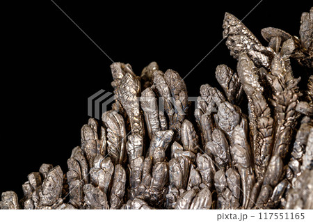 Macro of a stone Stibnite mineral on a black background Macro of a stone Stibnite mineral on a black background 117551165