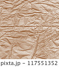 Kraft paper texture.Craft wrapping paper. The texture of a flat crumpled sheet of cellulose products. Old tattered page surface background. Eco-friendly empty aged recyclable packaging. 117551352