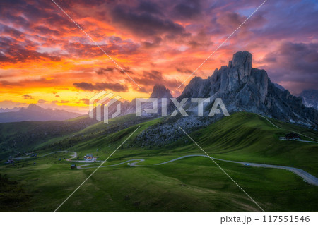 Road in mountains, golden sunlight and colorful sky at sunset Road in mountains, golden sunlight and colorful sky at sunset 117551546