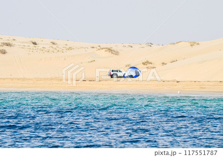 Camping on the Sand dunes descending into the creek 117551787