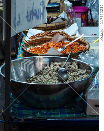 Street Food Vendor Selling Ground Pork in Thailand Street Food Vendor Selling Ground Pork in Thailand 117553239