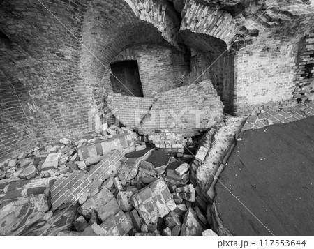 Crumbling brick wall in abandoned building ruins Crumbling brick wall in abandoned building ruins 117553644