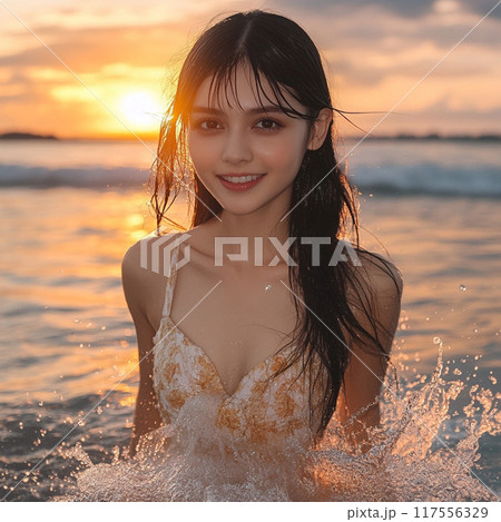 夕日を見つめるビキニの女性 117556329