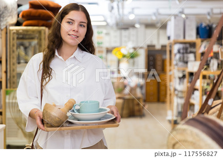 Woman shopping at store of household goods 117556827
