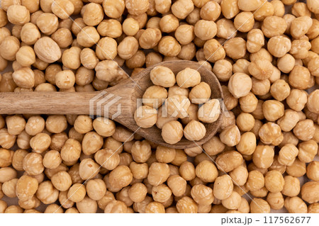 heap of hazelnuts in spoon close-up, top view heap of hazelnuts in spoon close-up, top view 117562677