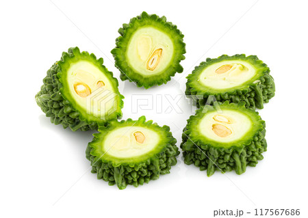 Fresh bitter gourd Bitter cucumber or bitter melon with cut slice isolated on a white background. 117567686