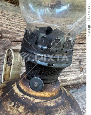 An old kerosene lamp with a glass shade. Close up. 117570451