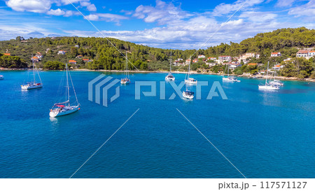 Drone view of yachts moored on buoys near the shore in the bay of Uvala Gradina near the town of Vela Luka on the island of Korcula in Croatia 117571127