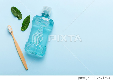 Mouthwash and fresh mint on colored background, top view with copy space for text 117571693
