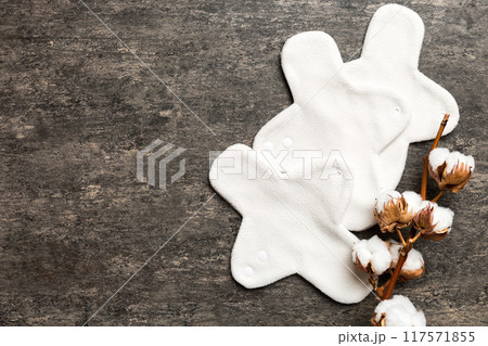 set of colorful bright reusable menstrual pads with cotton flower. zero waste woman periods concept top view with copy space 117571855