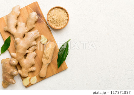ginger on Cutting board table, top view. Space for text ginger on Cutting board table, top view. Space for text 117571857