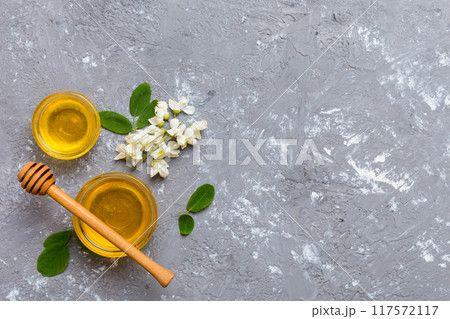 honey jar with acacia flowers and leaves. fresh honey top view flat lay 117572117