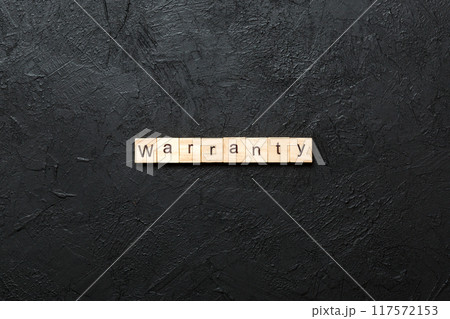 warranty word written on wood block. warranty text on table, concept warranty word written on wood block. warranty text on table, concept 117572153