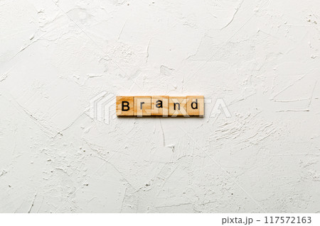 brand word written on wood block. brand text on table, concept brand word written on wood block. brand text on table, concept 117572163