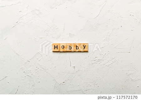 HOBBY word written on wood block. HOBBY text on cement table for your desing, concept HOBBY word written on wood block. HOBBY text on cement table for your desing, concept 117572170