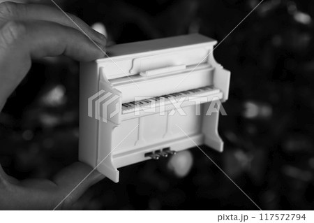 image of miniature piano dark background image of miniature piano dark background 117572794