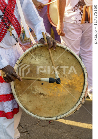 Drum player during a religious festival 117575160