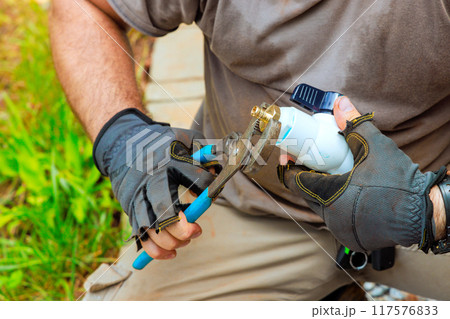 During process of connecting pvc plastic faucets to water supply system, plumber seals faucets together During process of connecting pvc plastic faucets to water supply system, plumber seals faucets together 117576833