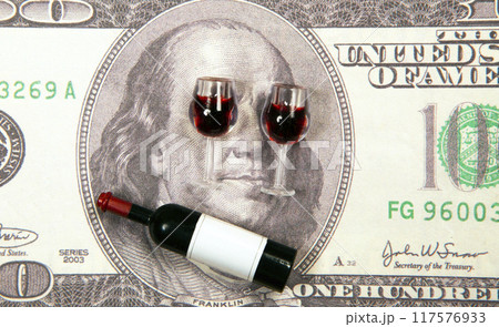 image of miniature wine bottle glass money banknote background 117576933