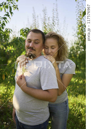 a middle-aged couple in love in the garden a middle-aged couple in love in the garden 117576967