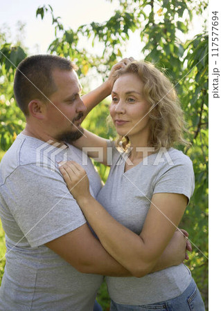 a middle-aged couple in love in the garden 117577694