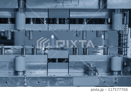 The metalworking process by progressive die in the light blue scene. The metalworking process by progressive die in the light blue scene. 117577708