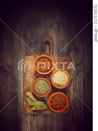 Georgian spices, in ceramic bowls, assortment, set of spices, utsho, adjika, Svan salt, ground coriander, top view, no people, 117578072