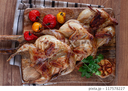 grilled quail meat, on a wooden chopping board, tobacco, in the oven, with spices, homemade, without people, grilled quail meat, on a wooden chopping board, tobacco, in the oven, with spices, homemade, without people, 117578227