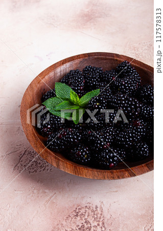 blackberries, in a wooden bowl, top view, no people, 117578313