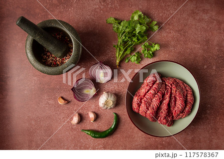 fresh minced meat, raw, with spices and ingredients. on the table, preparation, top view, fresh minced meat, raw, with spices and ingredients. on the table, preparation, top view, 117578367