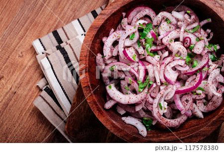 chopped red onion, with sumac and herbs, in a bowl, pickled Spanish onion, close-up, top view, 117578380