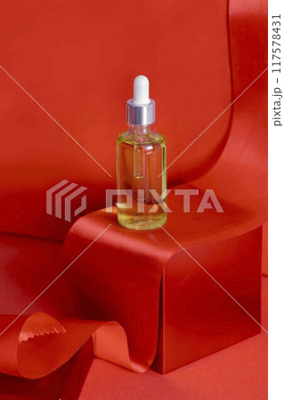 skin care serum or oil in a festive package, created to make them shine during the Christmas holidays 117578431