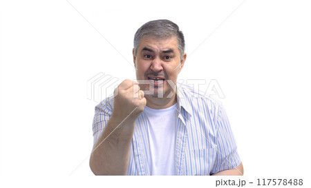 Aggressive Man Threatening with Fist 117578488