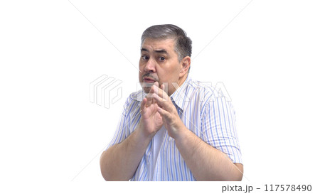 Man Cowering in Fear and Shielding Himself with Hands 117578490