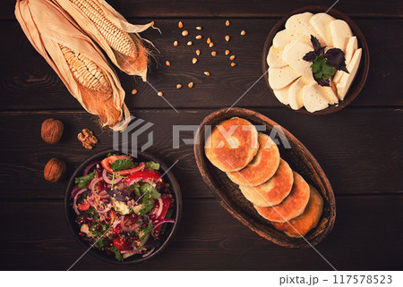 Mchadi, corn tortillas, traditional Georgian dish, corn bread, with Imeretian cheese, homemade, no people, on a wooden table, Mchadi, corn tortillas, traditional Georgian dish, corn bread, with Imeretian cheese, homemade, no people, on a wooden table, 117578523