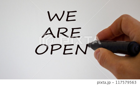 Hand writing 'we are open', isolated on beautiful white background. Concept. Hand writing 'we are open', isolated on beautiful white background. Concept. 117579563