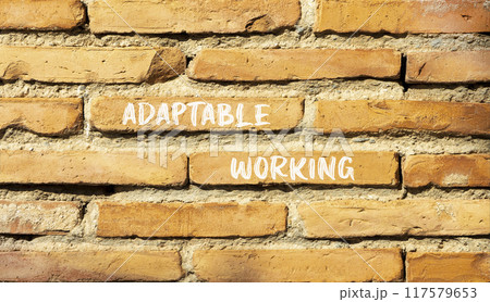 Adaptable working symbol. Concept words Adaptable working on beautiful brick wall. Beautiful red brown brick wall background. Business Adaptable working concept. Copy space. Adaptable working symbol. Concept words Adaptable working on beautiful brick wall. Beautiful red brown brick wall background. Business Adaptable working concept. Copy space. 117579653