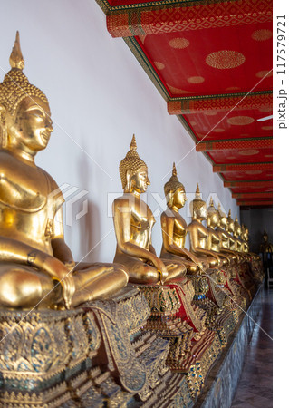 Beautiful Golden Buddha statues at Wat PhoTemple , focus selective Beautiful Golden Buddha statues at Wat PhoTemple , focus selective 117579721