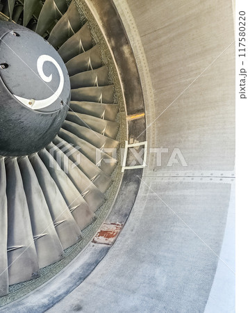 Close-up of aircraft engine with blades and cone . High quality photo Close-up of aircraft engine with blades and cone . High quality photo 117580220