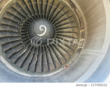 Closeup jet engine blades of airplane. High quality photo Closeup jet engine blades of airplane. High quality photo 117580222