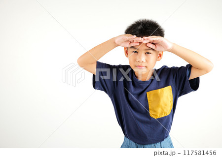 Searching concept. Asian young boy kid looking far away with hand over head at studio shot isolated on white background, Portrait of Happy primary child looking at distance with eyes shaded Searching concept. Asian young boy kid looking far away with hand over head at studio shot isolated on white background, Portrait of Happy primary child looking at distance with eyes shaded 117581456