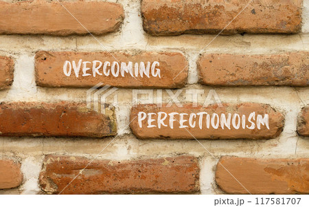 Overcoming perfectionism symbol. Concept words Overcoming perfectionism on beautiful brick wall. Beautiful red brown brick wall background. Business Overcoming perfectionism concept. Copy space. Overcoming perfectionism symbol. Concept words Overcoming perfectionism on beautiful brick wall. Beautiful red brown brick wall background. Business Overcoming perfectionism concept. Copy space. 117581707